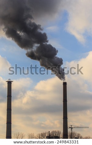 Heavy smoke and coal powered plant stacks