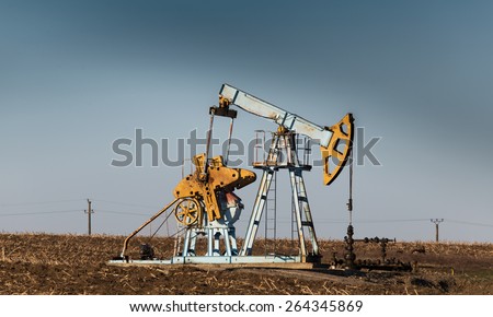 Oil and gas pump operating in agricultural area in Europe
