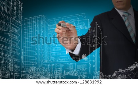 Business Man or architect draw building and cityscape