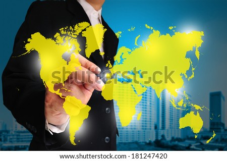 Global business concept with businessman that draws a world map.  Element of this image furnished by NASA.