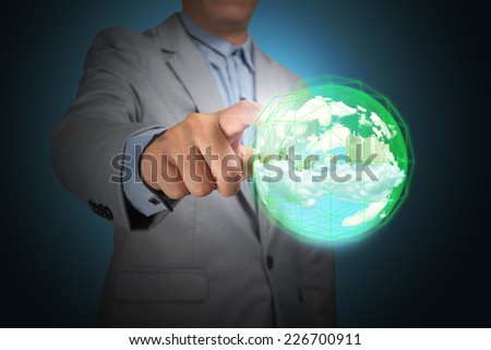 Business man hand holding planet earth glowing in crystal ball