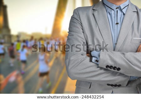 Business man sport manager and executive with background of Marathon Race
