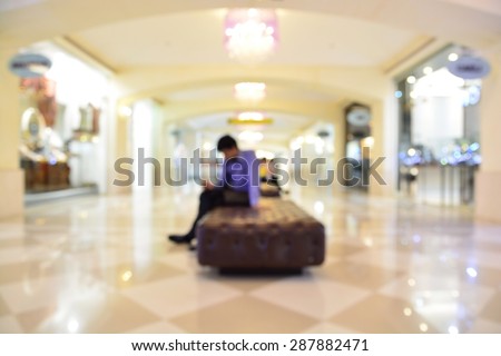 Abstract Blur or Defocus Background of People or Business man using Mobile Phone in Hotel Lobby