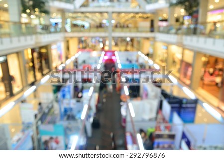 Blurred background with Bokeh of people shopping at mall in the big sale event.