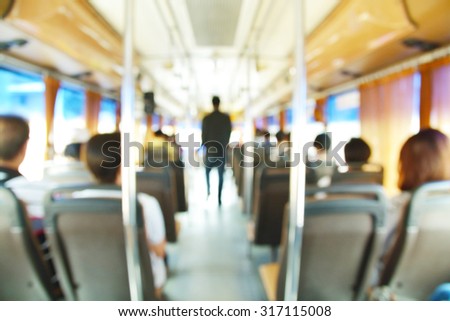 Abstract blur or defocus Background of People on Airconditioned Public Transportation Bus with bokeh.