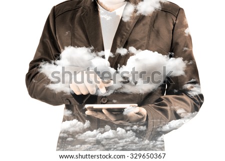 Double exposure of Business Man using Mobile Tablet PC with Cloud and Sky as Cloud Computing or Network concept.