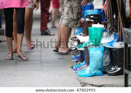 BANGKOK - OCTOBER 29: A rubber boot in front of shoe shop during Thai flood crisis on October 29, 2011 while demand on rubber boot is going high as water level in Bangkok, Thailand.