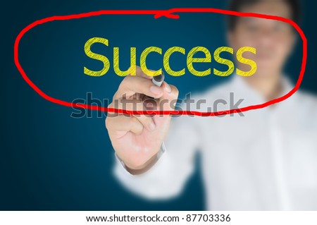 Business man write success on touch screen