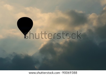 silhouette image of hot air balloon with beautiful blue sky