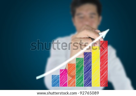 Hand of business man write a business graph on tablet pc touch screen