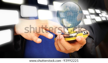 Hand of business man touch screen of mobile phone with transparent button flying through earth globe