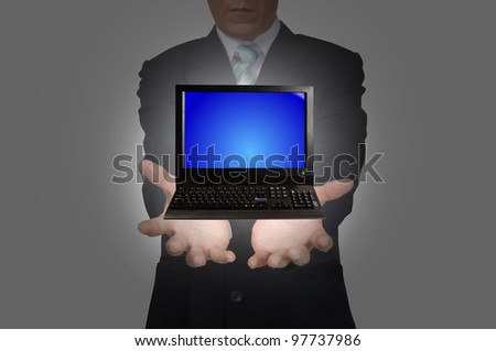 Desktop computer on hand of Business Man