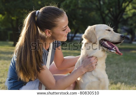 girl play with dog in park