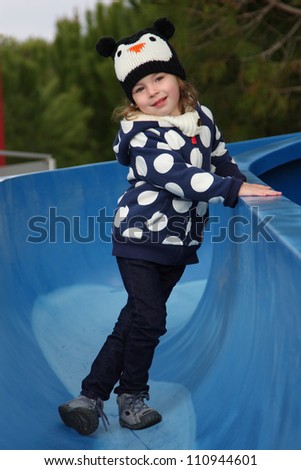 Baby girl on the slide