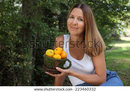 Girl with tangerines. Vintage tangerines. A woman of 30 years of fruit.