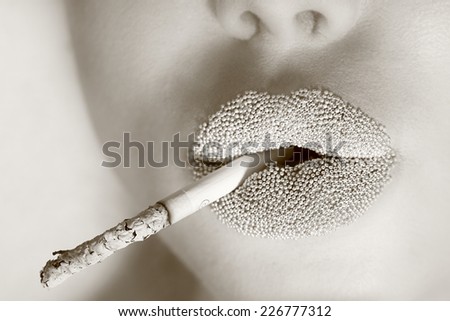 Smoking. Lip Makeup. Lips close dress with cigarette. Nicotine addiction