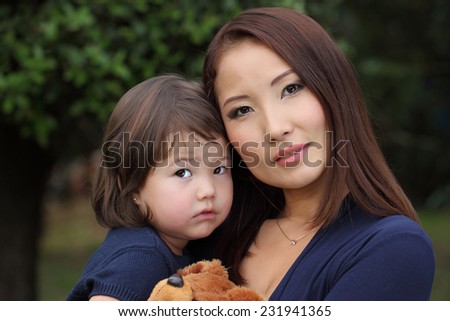 Family Koreans. Mother and daughter. Mother with her baby in her arms. Mom and baby Asian appearance.
