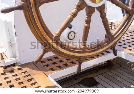 Old boat steering wheel from brass and wood
