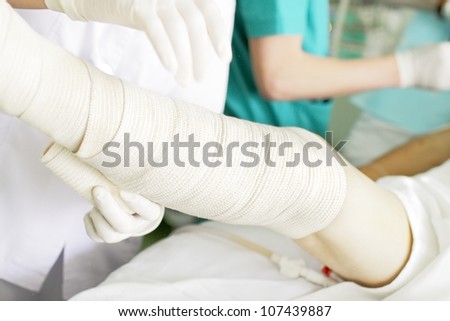 Bandaging of the legs with elastic bandage. photo.