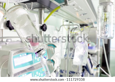 Medicine bottles, infusion pumps, tubing, infusion. The typical picture of ICU.