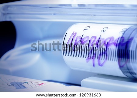 great syringe in a syringe pump. Medical technology.