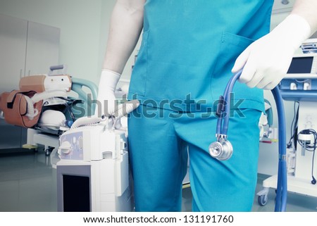 doctor in an emergency situation with a defibrillator and a stethoscope.