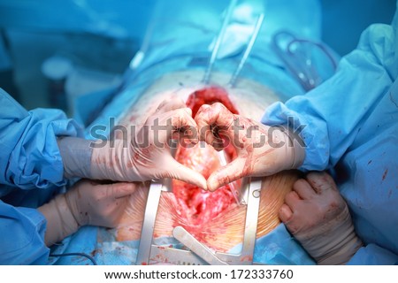 Hand surgeons in the shape of heart