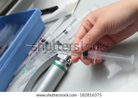 Seating Area of nurse and syringe before the injection