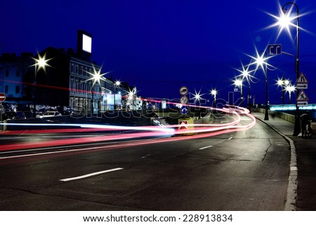 Night speed on the asphalt road in the city
