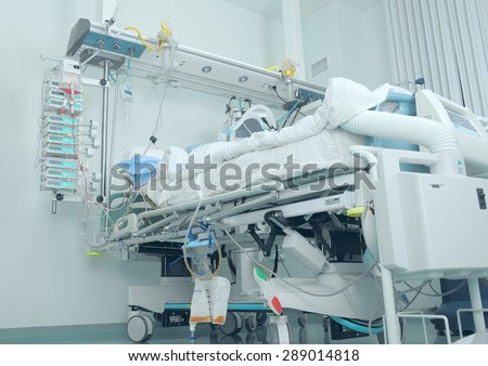 Modern bed in the intensive care with patient