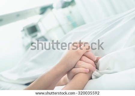 Gentle touch in a hospital ward close up