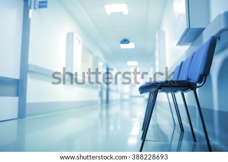 Deserted hospital corridor, concept of extended waiting.