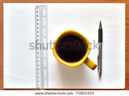 photo of line; paper; tea cup and Pen on a wooden table;