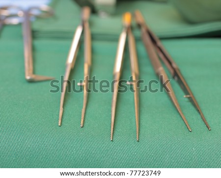 photo of three medical forceps in a small depth of field.
