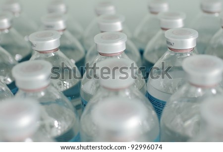 rows of identical bottles. photo reflects the typical, standard, conveyor, medicine, manufacturing