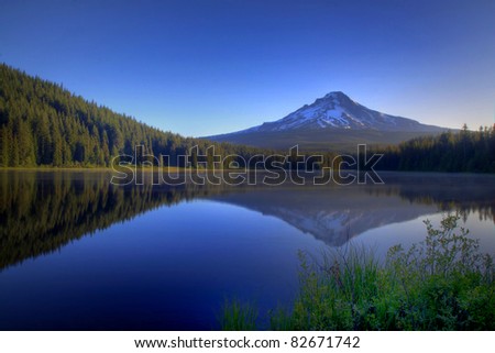 Pre Dawn Image Of Snow Capped Mount Hood Reflecting Off The Glass Smooth Surface Of Lake Trillium In Oregon In The Pacific Northwest.