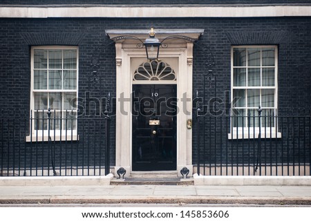 London - Jun 16: Entrance Door Of 10 Downing Street In London On June 16, 2013. The Street Was Built In The 1680s By Sir George Downing And Is Now The Residence Of The Prime Minister.