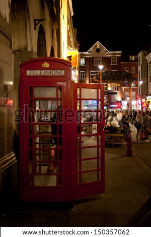 LONDON, UK - AUG 16: people enjoy the nightlife in Chinatown in London on August 16, 2013. With a large variety of Chinese restaurants and souvenir shops, the area is very crowded till late at night.