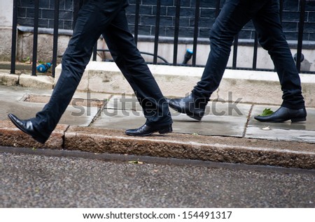 Two men walk together