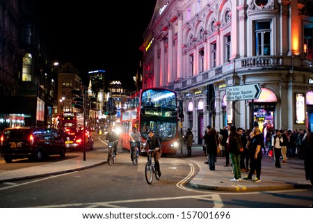 London, Uk - Oct 4: People Stroll In Piccadilly On A Friday Night In London On October 4, 2013. From Pubs To Upmarket Bars, Nightclubs And Late Night Shopping, Piccadilly Is A Popular Nightlife Area.