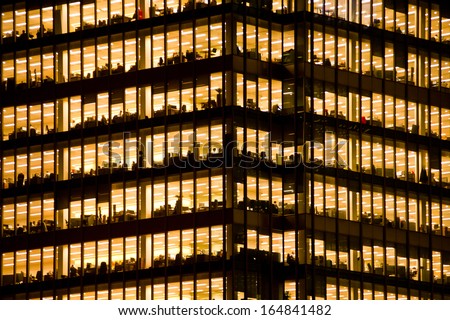 LONDON - NOV 28: people work in an office building in London on November 28, 2013. Full-time employees in the UK work longer hours than the EU average, according to the Office for National Statistics.