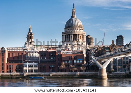 St Paul\'s Cathedral in Londonseen from the Millennium Bridge at sunrise on a beautiful sunny day in 2014.Available space for text on both upper sides of the image.