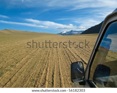 Offroad: car driving on a sand path in Ladakh, India\
\
Shot on the way to the Tso Moriri Lake.