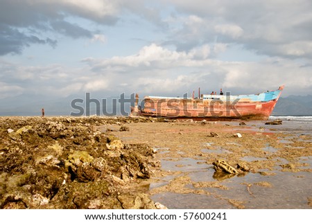 A ship wreck laying on a coral sea bed in Gili Trawangan, Indonesia.