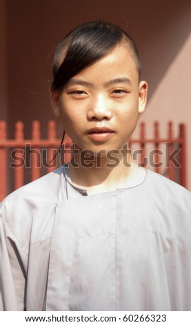 HUE, VIETNAM - SEPTEMBER 3: unidentified buddhist novice in Thien Mu Temple in Hue, Vietnam Sep 3, 2010. Buddhism represents about 17% of the population with more than 20mln members  (AsiaNews, 2009)