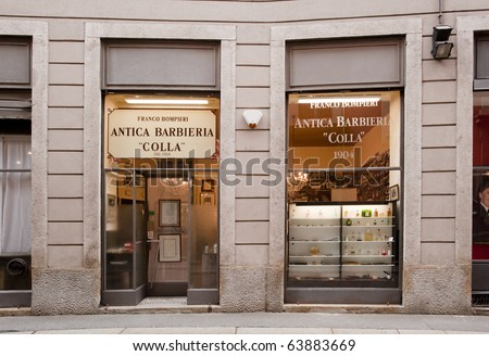 MILAN - OCT 27: Historical barber shop facade, since 1904, in Milan, on Oct 27, 2010. Many italian operators organize tours among palaces, squares and historical shops of Milan