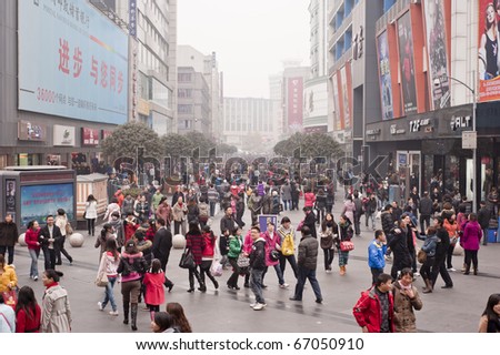 CHENGDU, CHINA - DEC 12: people strolling in Chengdu on Dec 12, 2010. China\'s retail sales of consumer goods grew 18.7% in November year on year, the National Bureau of Statistics (NBS) reports.