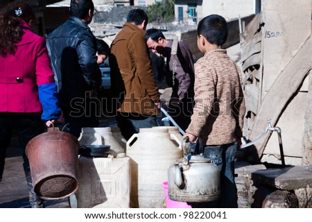 Caohai, China - FEB 7: Chinese citizens waiting for their turn to collect fresh water in Caohai, on February 7, 2011. China has serious water shortage problems caused by over-use and pollution