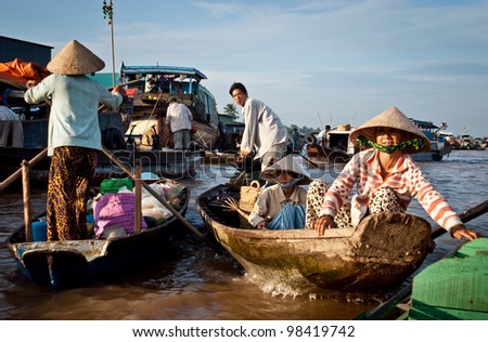 CAN THO, VIETNAM- AUG 27: Unidentified Vietnamese persons during the Floating Market in Can Tho, Vietnam on August 27, 2010. Cai Rang Market is the most important floating market on the Mekong Delta.