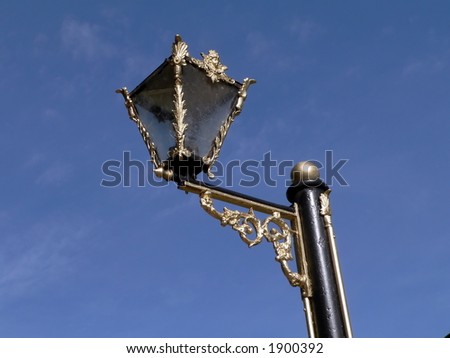 Aged gilded street lamp
